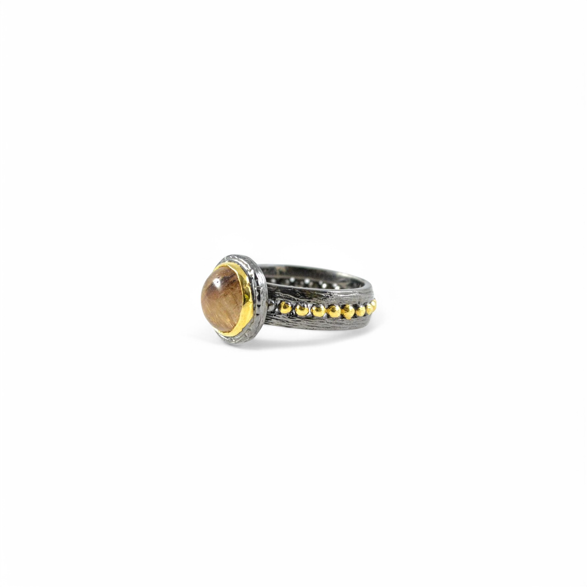 Handmade oxidised silver ring with brown rutilated quartz and gold bezel.